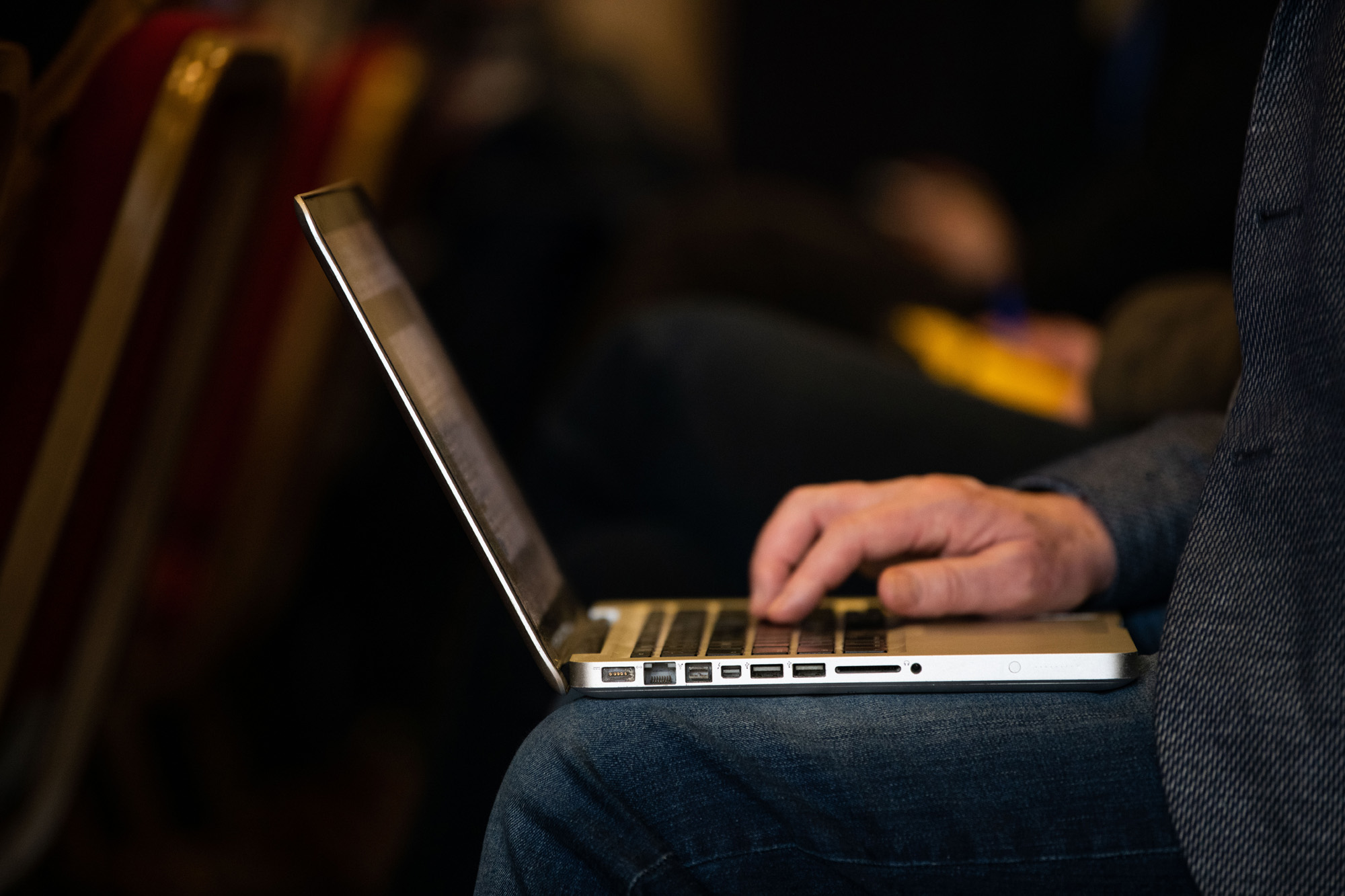 A person uses a laptop to access information 
