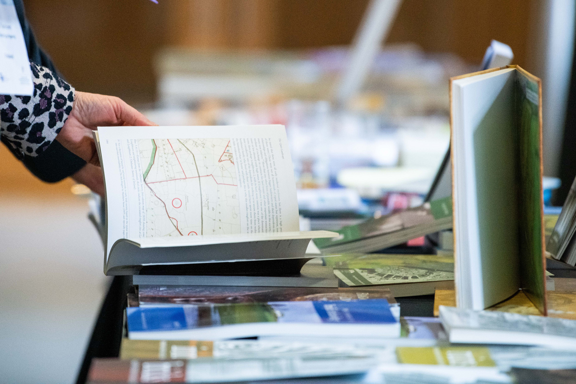 A person browses through a publication