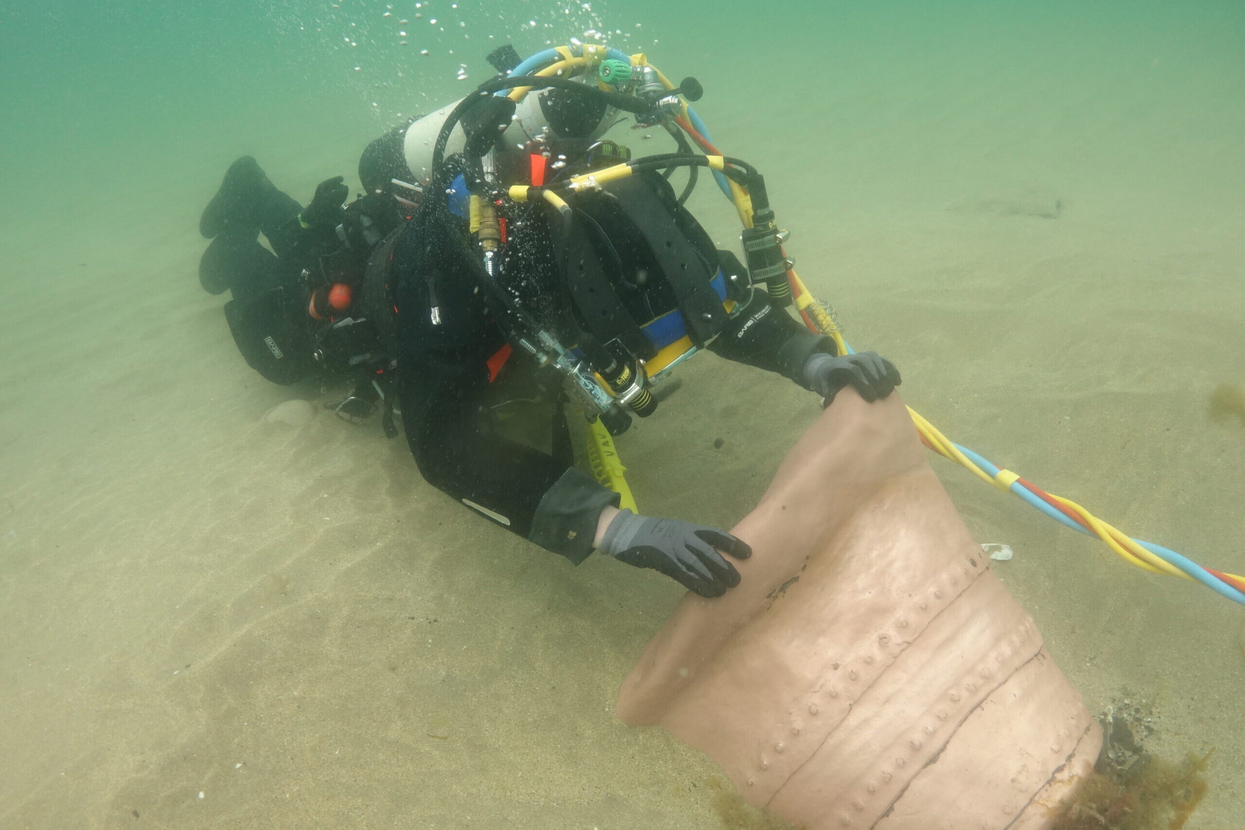 Underwater archaeologist finds an artefact at Streedagh Beach, County Sligo
